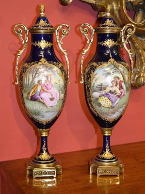 Lot 85 - A Pair of Gilt Metal Mounted Sèvres Style Porcelain Urn Shape Vases and Covers, with pine cone...