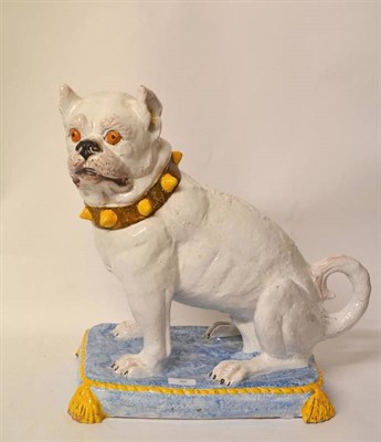 Lot 92 - A French Maiolica Pottery Figure of a Bulldog, the white coated dog seated on his haunches with...