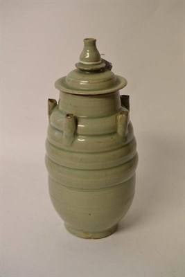 Lot 106 - A Chinese Celadon Glazed Five-Spouted Jar and Cover, Song Dynasty, of ribbed ovoid form, the...