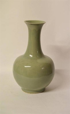 Lot 114 - A Chinese Celadon Porcelain Vase, 19th century, with slightly flared rim and compressed ovoid body
