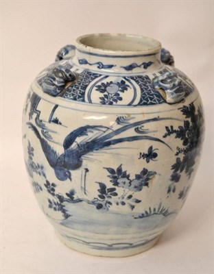 Lot 117 - A Chinese Porcelain Ovoid Jar, 17th century, with four mask handles to the shoulders, painted...