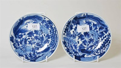 Lot 127 - A Pair of Chinese Porcelain Saucer Dishes, Kangxi, painted in underglaze blue with birds...