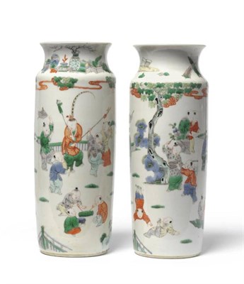Lot 142 - A Matched Pair of Chinese Porcelain Sleeve Vases, in Kangxi style, with waisted necks, painted...