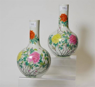 Lot 155 - A Pair of Chinese Porcelain Bottle Vases, bears Qianlong reign mark, painted in famille rose...