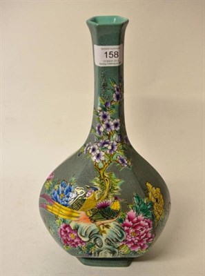 Lot 158 - A Chinese Porcelain Hexagonal Bottle Vase, bears Qianlong reign mark, painted in famille rose...