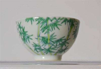 Lot 161 - A Chinese Porcelain Tea Bowl, externally painted with stems of leafy bamboo in underglaze blue...