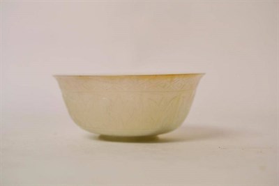 Lot 163 - A Chinese Pale Jade Small Bowl, 17th/18th century, carved in Mughal style with panels of...