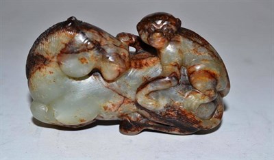 Lot 165 - A Chinese Jade Carved Group of a Horse and Ape, in late Ming style, the recumbent horse turning its