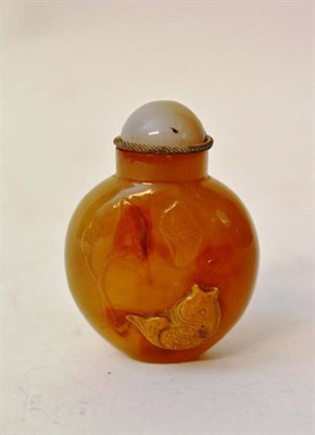 Lot 172 - A Chinese Hardstone Snuff Bottle, Qing Dynasty, of flattened ovoid form, carved with a fish and...