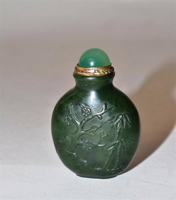 Lot 173 - A Chinese Jade Type Snuff Bottle and Stopper, Qing Dynasty, of flattened ovoid form, carved...