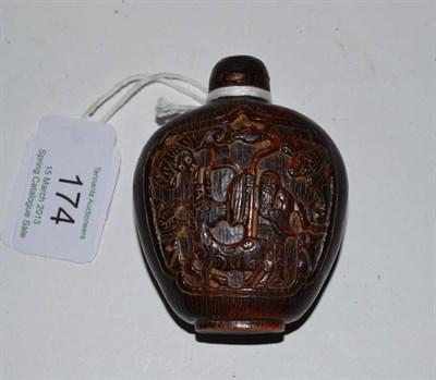Lot 174 - A Chinese Carved Horn Snuff Bottle and Stopper, 18th/19th century, of flattened ovoid form...