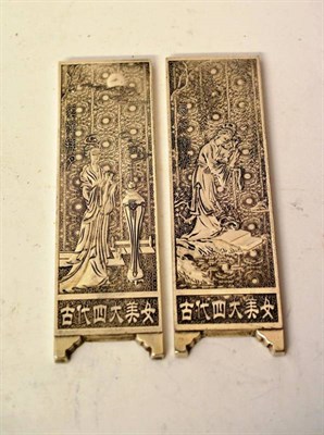 Lot 184 - A Pair of Chinese White Metal Scroll Weights, of rectangular form, cast with maidens and with...