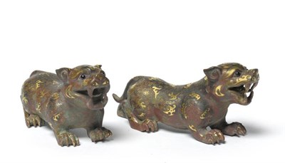 Lot 191 - A Pair of Chinese Bronze Lion Dogs, in archaic style, inlaid in gold with scrolls and foliage, 14cm