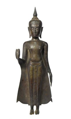 Lot 193 - A Thai Bronze Figure of Buddha, probably 17th or 18th century, the standing figure with flowing...