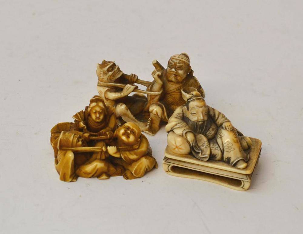 Lot 202 - A Japanese Ivory Netsuke, Meiji period (1868-1912), as a seated man holding a goblet and oni...