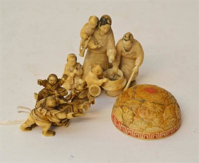 Lot 204 - A Japanese Ivory Okimono, Meiji period (1868-1912), as a family of five about a cooking pot, 7cm; A
