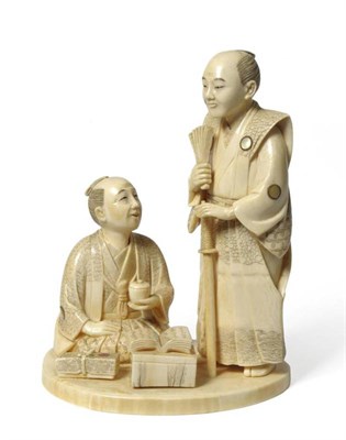 Lot 210 - A Japanese Ivory Okimono, Meiji period (1868-1912), as a standing figure in traditional costume...