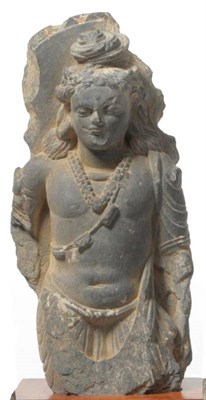 Lot 213 - A Gandhara Schist Figure of the Buddha, 2nd-4th century AD, standing on a pedestal, 28cm high,...