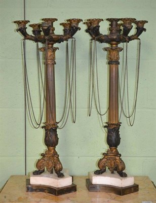 Lot 228 - A Pair of French Bronze Candelabra, early 19th century, with central sconce flanked by five further