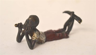 Lot 231 - A Bergman Cold Painted Bronze Figure of a Negro Boy, lying on his front smoking a pipe,...