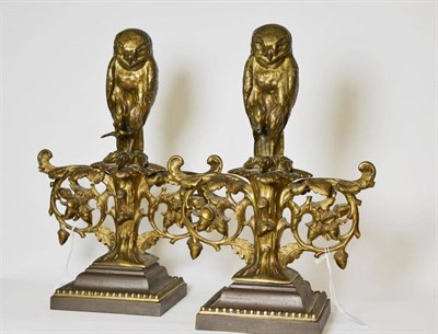 Lot 241 - A Pair of Gilt and Patinated Metal Andirons, late 19th century, each as an owl perched on scrolling