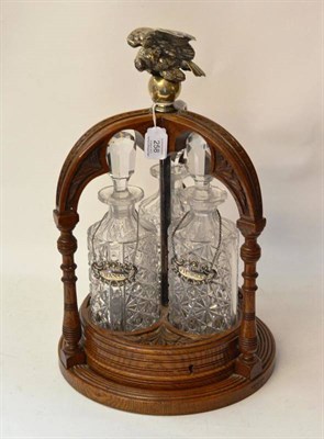 Lot 258 - An Elkington's Patent Oak, Silver Plate and Glass Three-Bottle Tantalus, mid 19th century,...