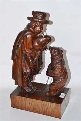 Lot 263 - A Black Forest Dancing Bear Figure Group, as a bagpiper in hat and long cloak playing to a bear...