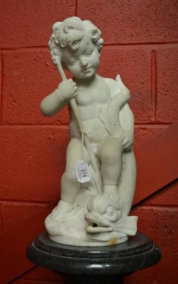 Lot 274 - An Italian White Marble Figure of a Cherub, 19th century, sitting holding a dolphin and trident...
