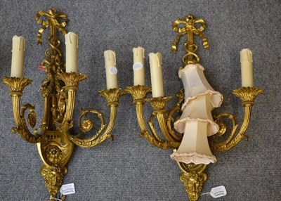 Lot 276 - A Pair of Louis XVI Style Gilt Metal Wall Lights, each with three scroll branches with foliate drip