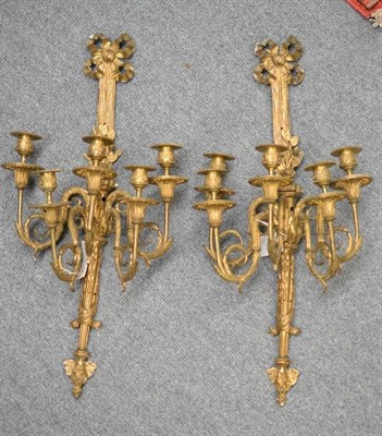 Lot 281 - A Pair of Gilt Metal Five-Light Wall Sconces, in George III style, with foliate cast sconces...