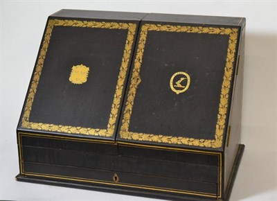 Lot 291 - A Canton Lacquer Stationery Cabinet, circa 1840, the two-hinged sloping doors gilt with an armorial