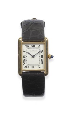 Lot 318 - An 18ct Gold Rectangular Wristwatch, signed Cartier, Paris model: Tank, circa 1975, mechanical...