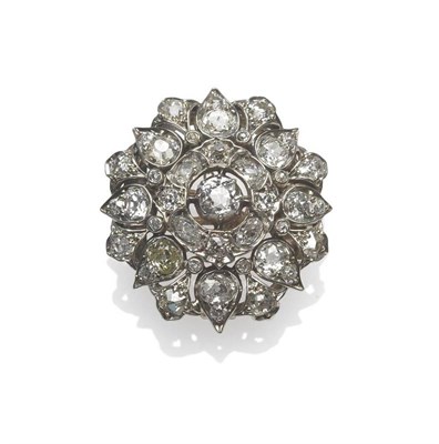 Lot 360 - A Victorian Diamond Set Flower Brooch, set with old cut diamonds in white claw and collet settings