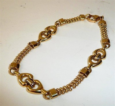 Lot 386 - A Fancy Link Bracelet, articulated links joined by series of beads, length 17.5cm