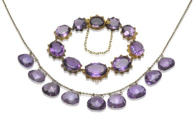 Lot 389 - An Amethyst Bracelet, of graduated oval mixed cut amethysts, in collet settings with bead...