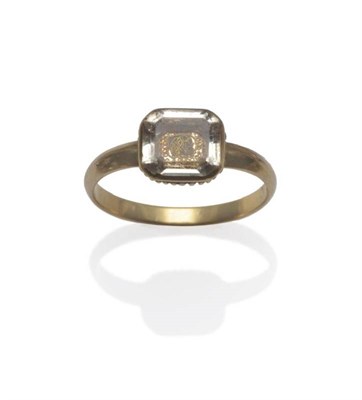 Lot 390 - A Georgian Mourning Ring, set with a step cut rock crystal over gold wire spelling 'DO', within...