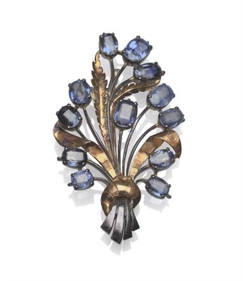 Lot 391 - A Sapphire Set Spray Brooch, the cushion shaped sapphires in white claw settings in the form of...