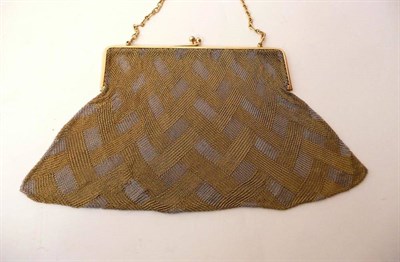 Lot 400 - A Two Colour Purse, the yellow and white mesh in an entwined geometric design, with a solid...