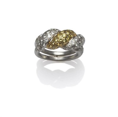 Lot 404 - A Yellow and White Diamond Knot Ring, brilliant cut and single cut diamonds pavé set into...