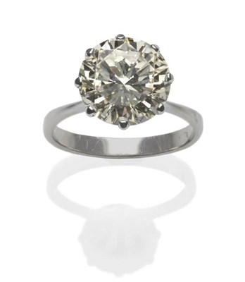 Lot 423 - A Diamond Solitaire Ring, the round brilliant cut diamond in a white eight claw setting, to a...