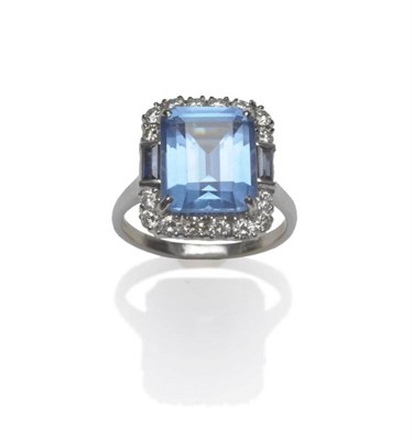 Lot 436 - An 18 Carat White Gold Synthetic Blue Spinel, Sapphire and Diamond Ring, the blue step cut...