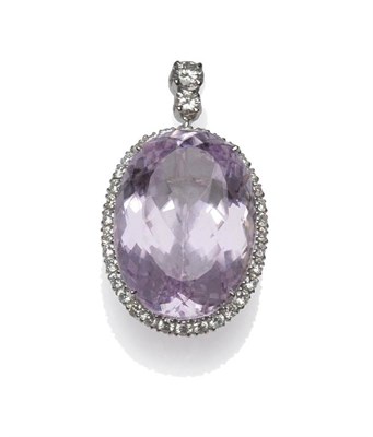 Lot 438 - An 18 Carat White Gold Kunzite and Diamond Pendant, the oval cut kunzite within a border of...