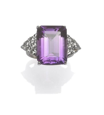 Lot 444 - An 18 Carat White Gold Amethyst and Diamond Ring, the emerald-cut amethyst in a corner claw...