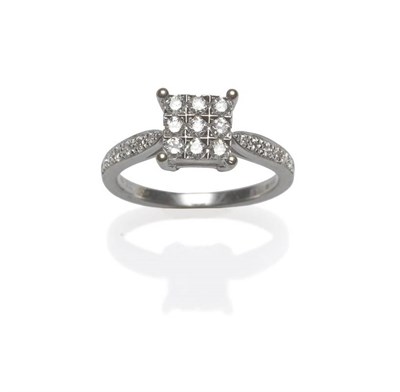 Lot 445 - An 18 Carat White Gold Diamond Cluster Ring, nine round brilliant cut diamonds in claw settings...