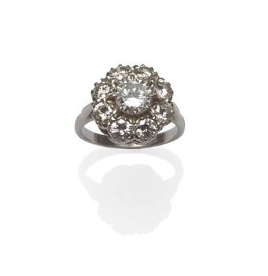 Lot 450 - A Diamond Cluster Ring, a round brilliant cut diamond centrally, within a border of eight...