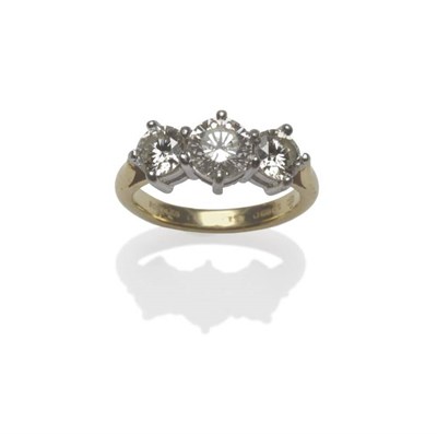 Lot 457 - An 18 Carat Gold Diamond Three Stone Ring, by Boodle & Dunthorne, the graduated round brilliant cut