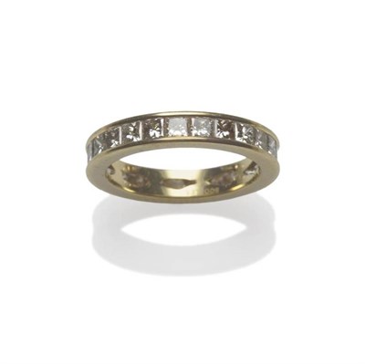 Lot 458 - An 18 Carat Gold Diamond Eternity Ring, by Boodle & Dunthorne, princess cut diamonds channel...