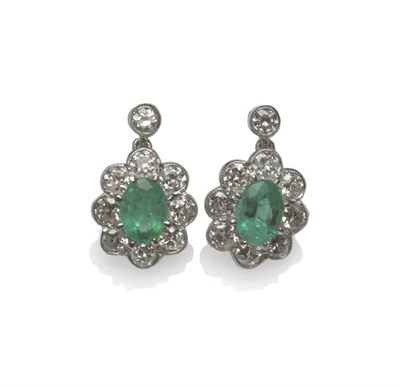 Lot 463 - A Pair of Emerald and Diamond Drop Earrings, an old cut diamond in a white collet setting...