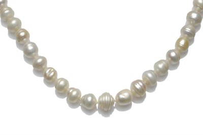 Lot 465 - A South Sea Baroque Pearl Necklace, thirty-one pearls strung to an 18 carat gold spherical...