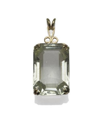 Lot 489 - An Aquamarine Pendant, the light green oblong step cut stone with truncated corners, in a...